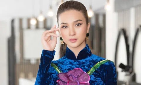 Kim Tuyến diện áo dài đi sự kiện