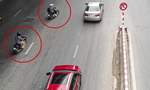 Hà Nội: Dòng xe máy vô tư cắt mặt ô tô đang xuống dốc để đi ngược chiều
